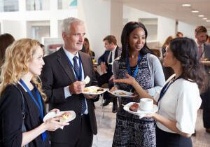 Professionals networking and talking at an event